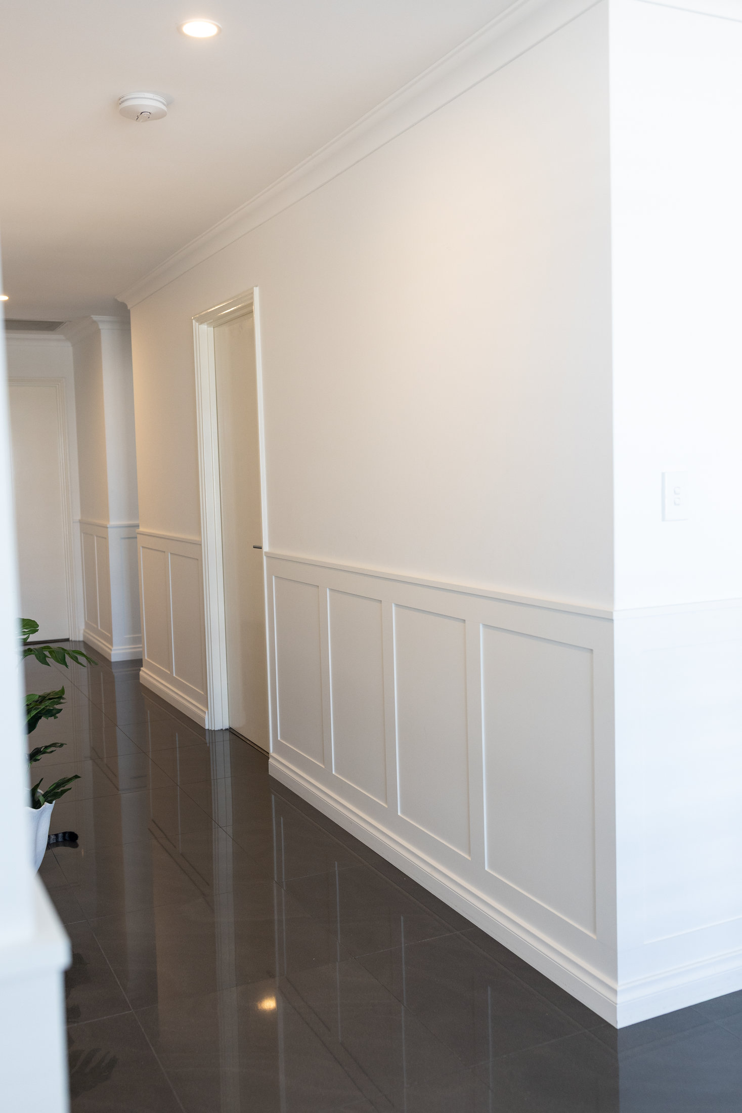 Perth hallway with raised-panel wainscoting and refined interior finish carpentry